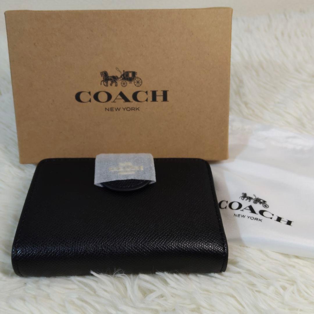 新品✨COACH ブラック レザー 二つ折り 財布 シンプル